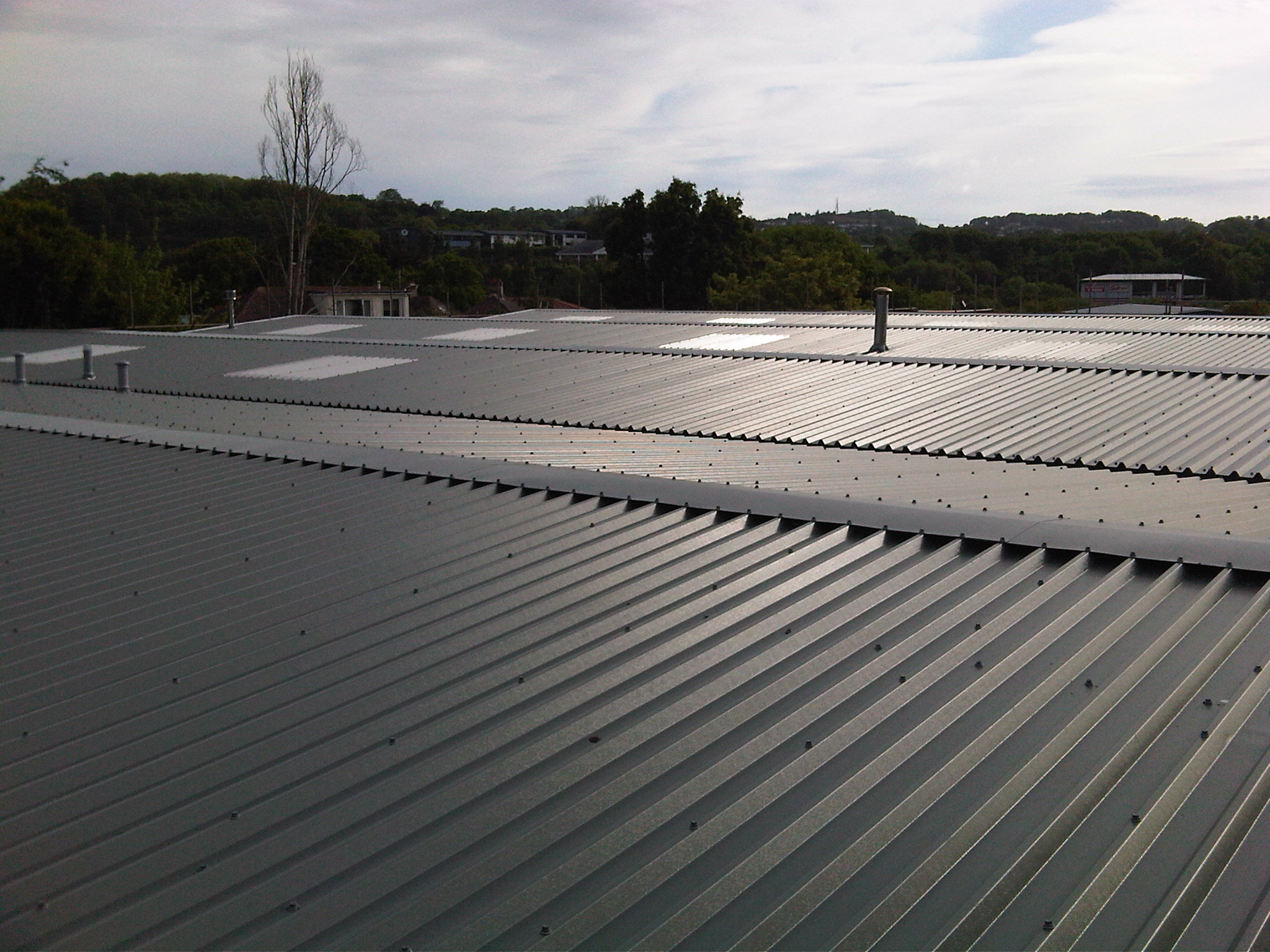 Gutter Lining Replacement and Oversheeting Roof to NHS Medical Records Building Devon